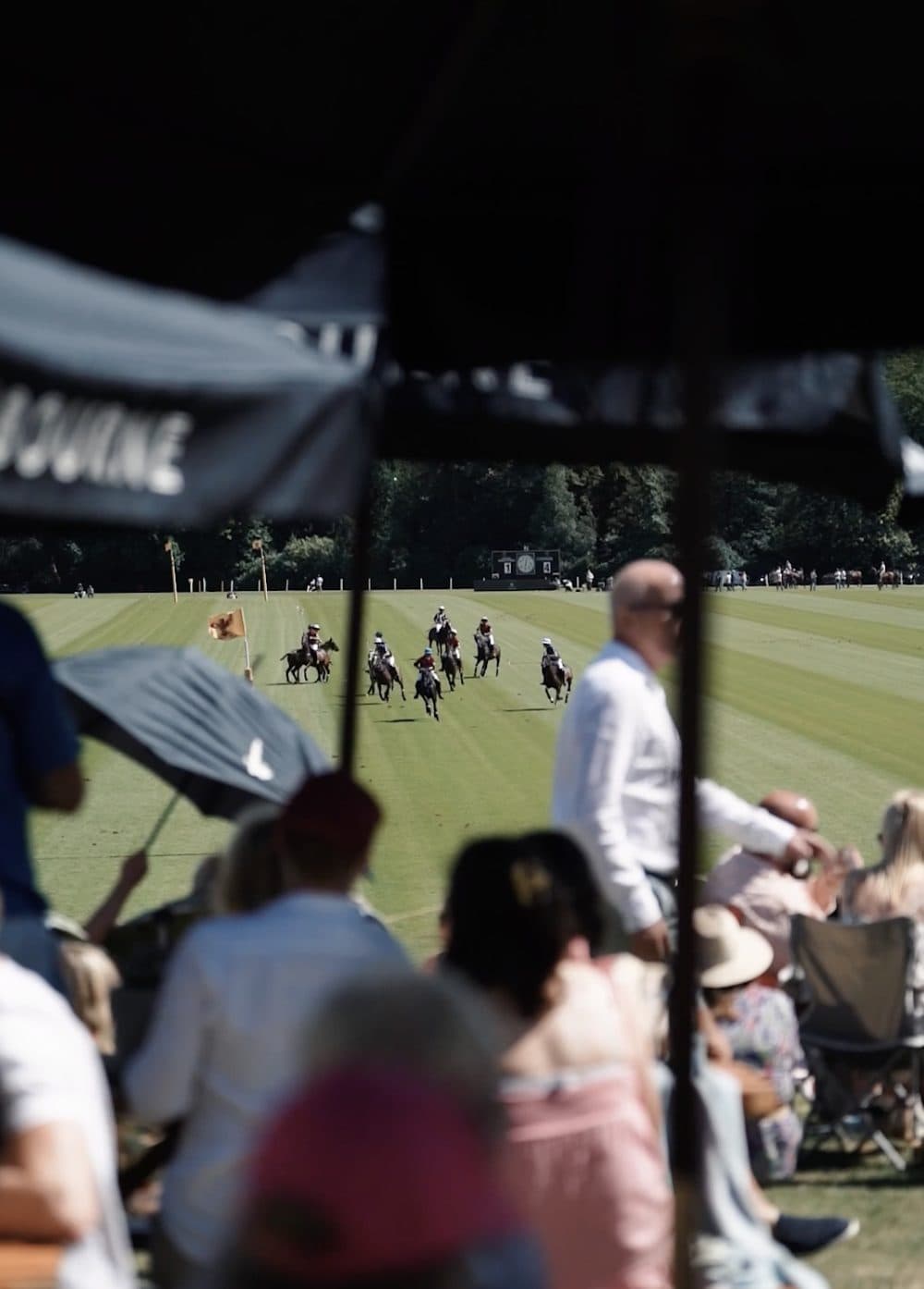 Guests watching the polo from the SafeRock® hospitality marquee